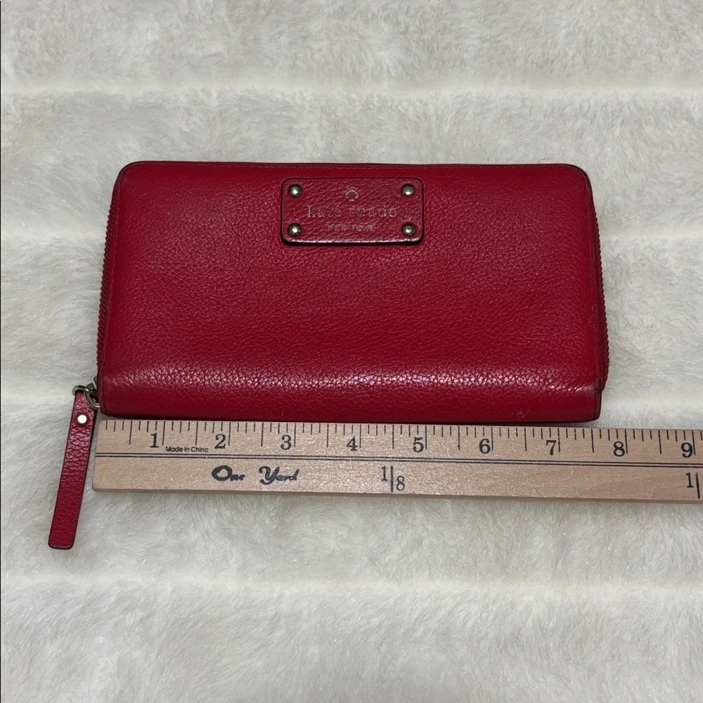 Kate Spade Red Pebbled Leather Zip Around Wallet with Logo Plate